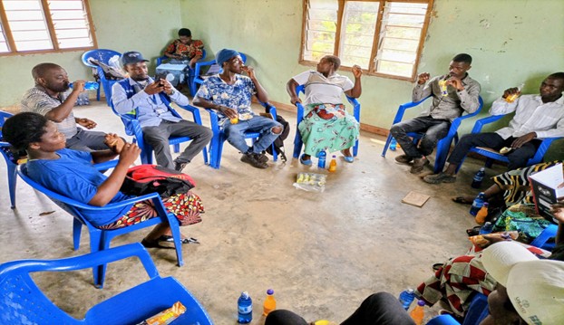 A Close Up Photo Of Participants Engaged In Savings Group Discussions