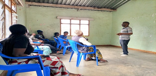 a photo of a facilitator guiding participants during a training.