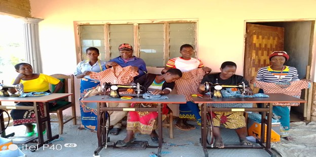 Young mothers and women during tailoring training in TA Dambe demonstrating their skills Young Mothers And Women During Tailoring Training In TA Dambe Demonstrating Their Skills